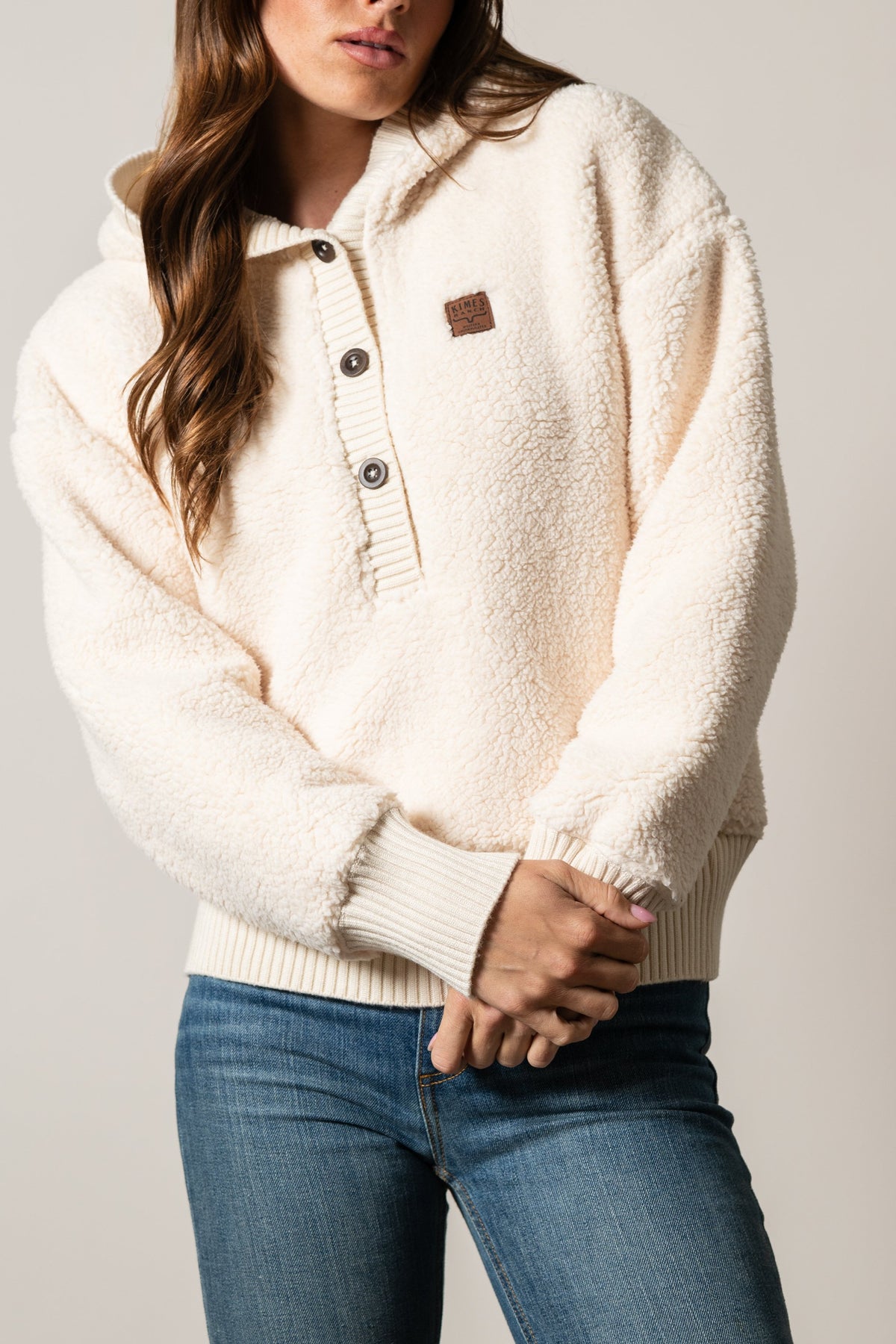 Kimes Ranch Shayla hoodie in Natural with a hood, button placket, ribbed cuffs, and logo patch on chest