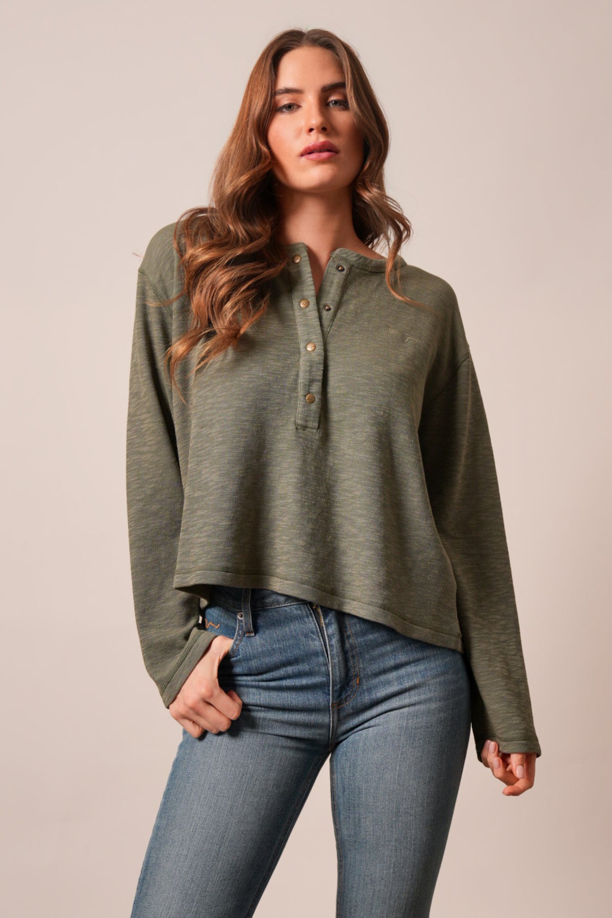 Kimes Ranch Sidney top in moss, a long sleeve henley featuring a button placket and relaxed silhouette