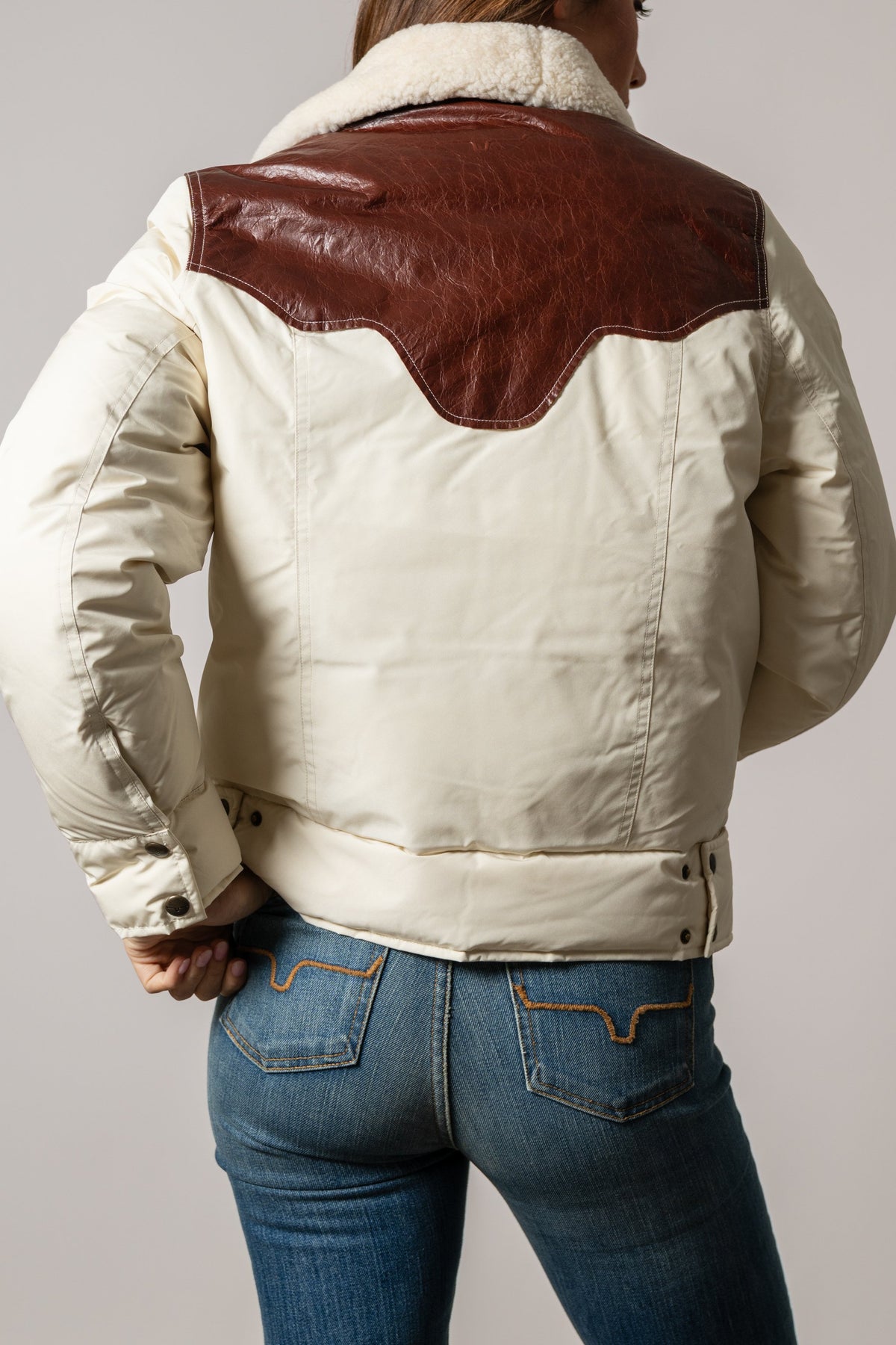 Kimes Ranch Sierra jacket back view, natural with chocolate leather yoke, sherpa collar, snap cuffs