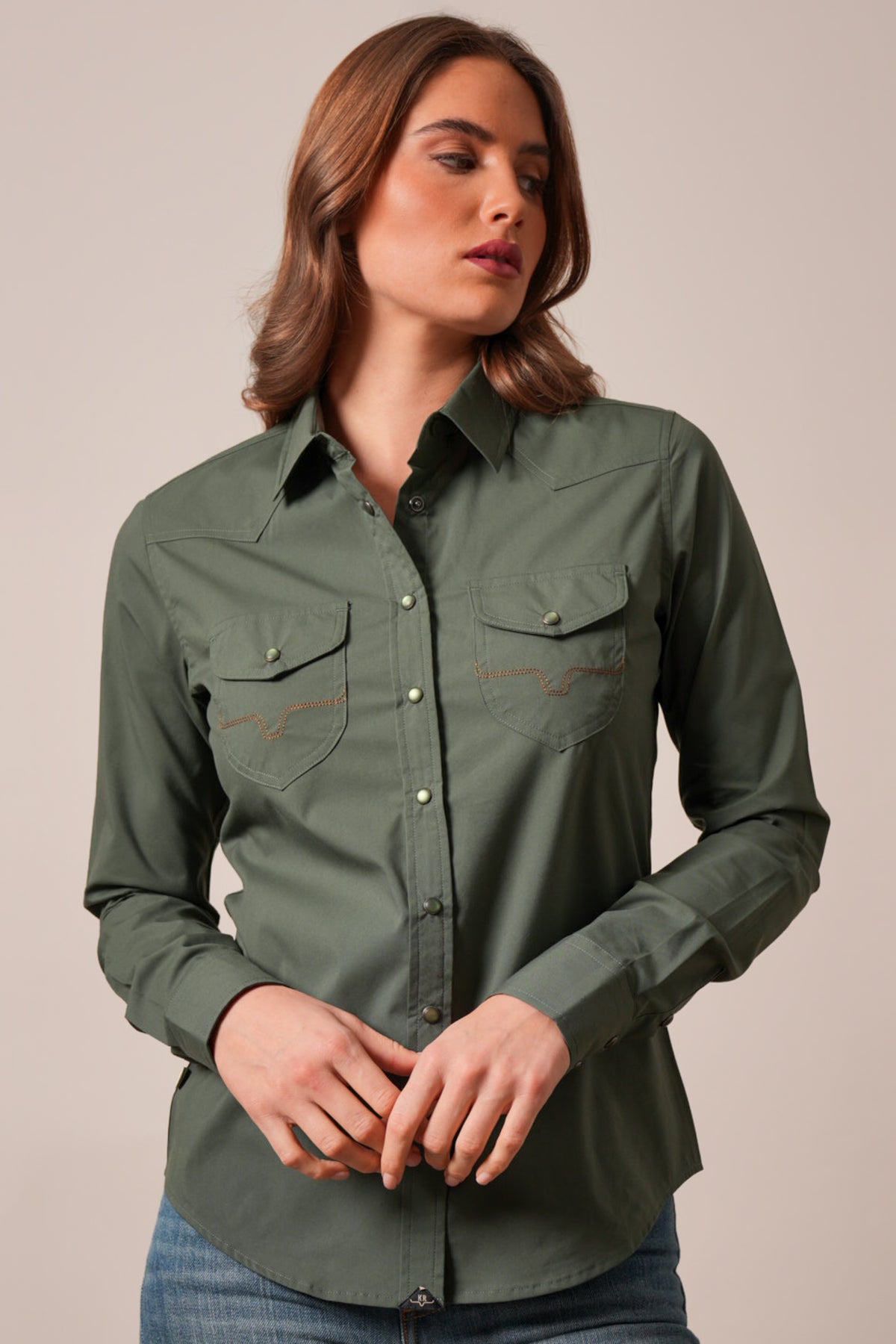 Kimes Ranch Skeeter top in dark olive with yokes and two front pockets with curved stitching