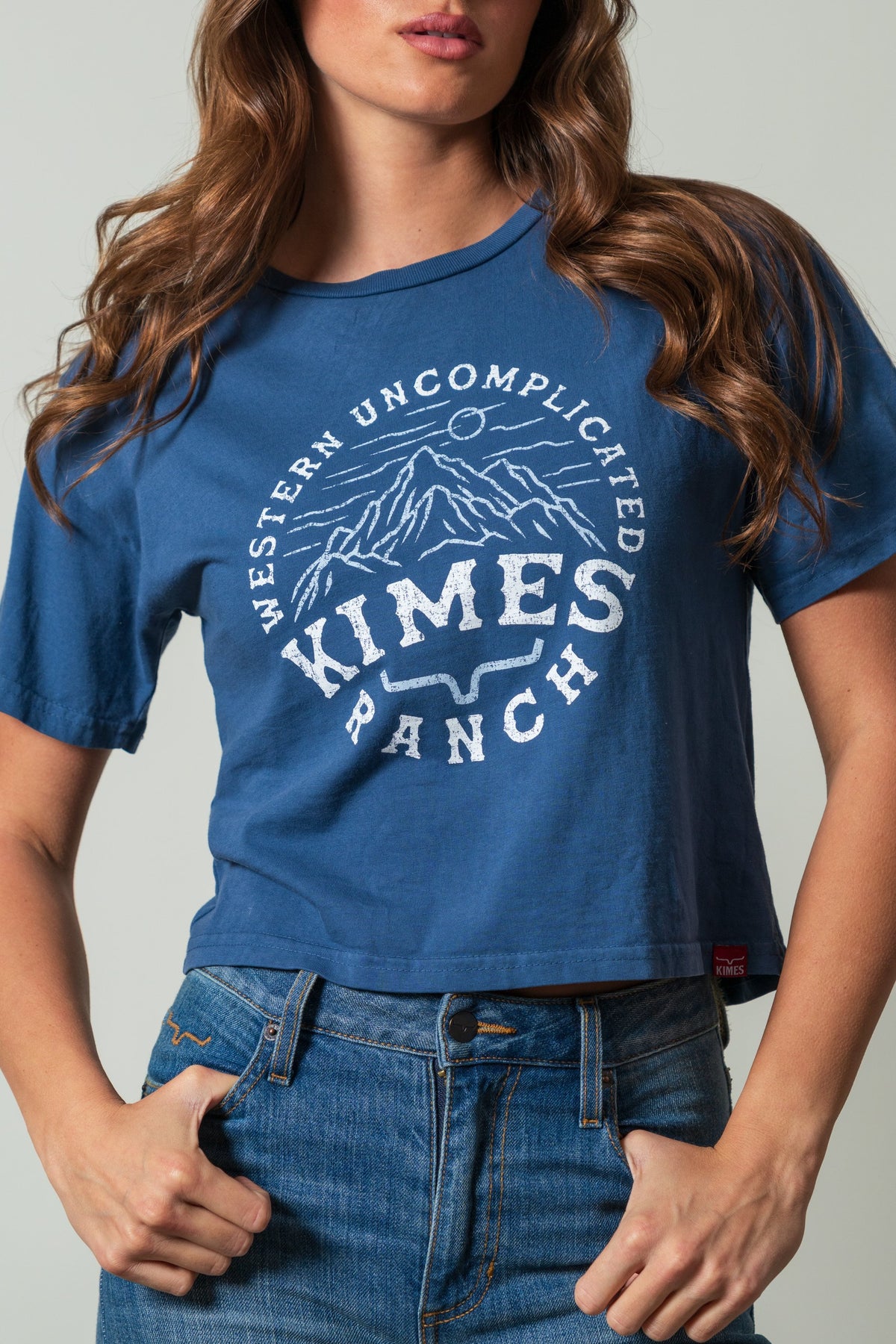 Kimes Ranch The Pass shirt in dark blue with a white mountain graphic and "Western Uncomplicated Kimes Ranch" text; #color_dark blue