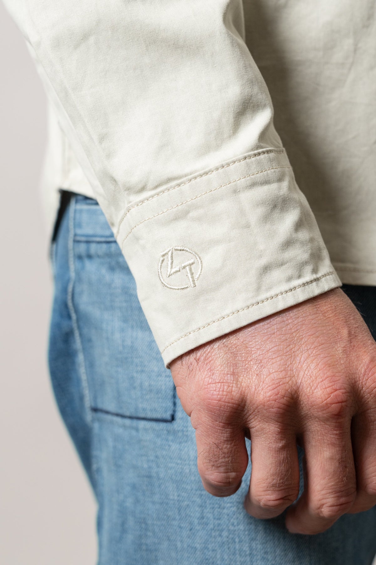 Kimes Ranch ZT Caliber dress shirt, army green long sleeve cuff with embroidered Kimes Ranch logo and stitching detail