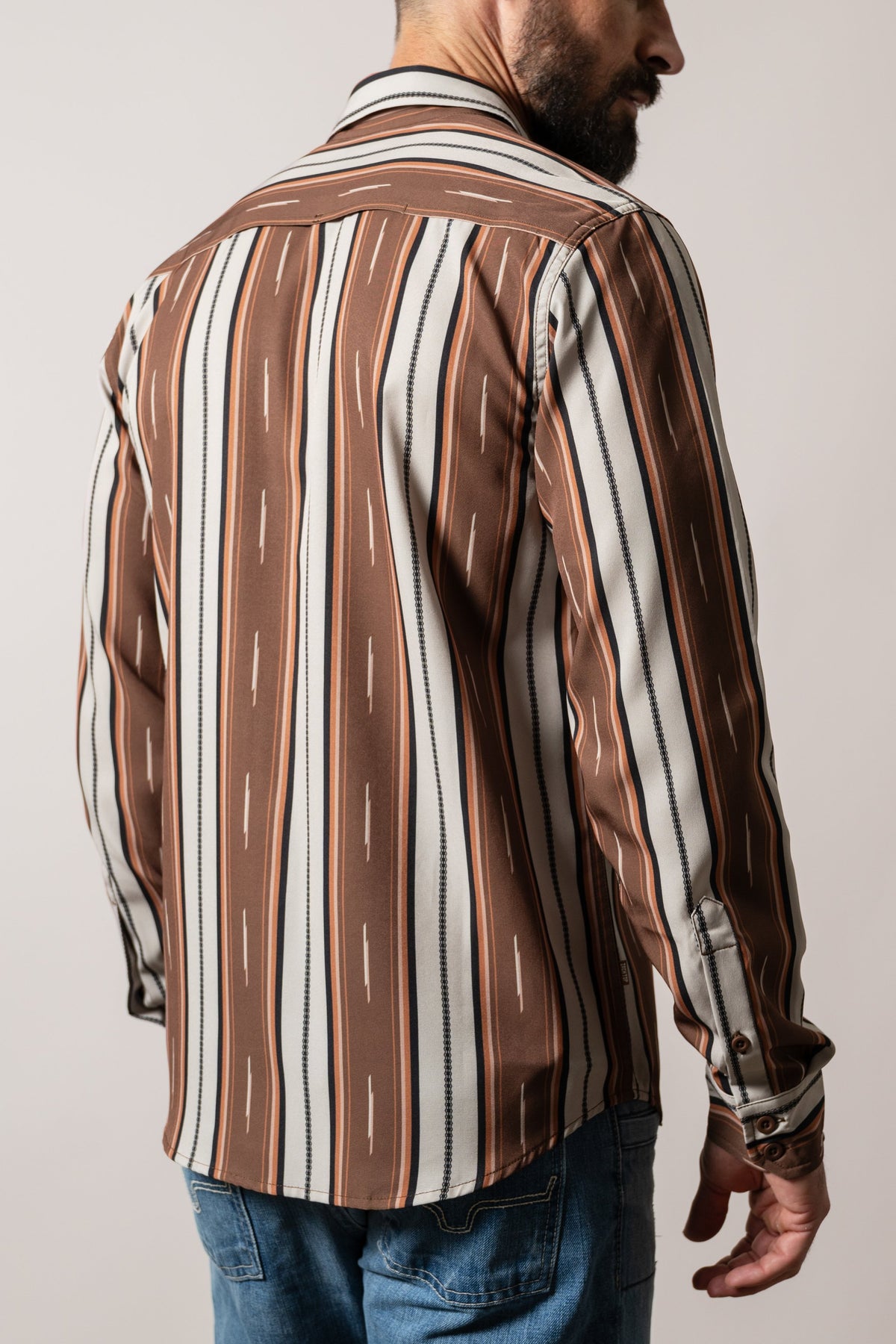 Kimes Ranch ZT Hickory dress shirt in Brown, shown from back, with vertical stripes on yoke and body, button cuffs