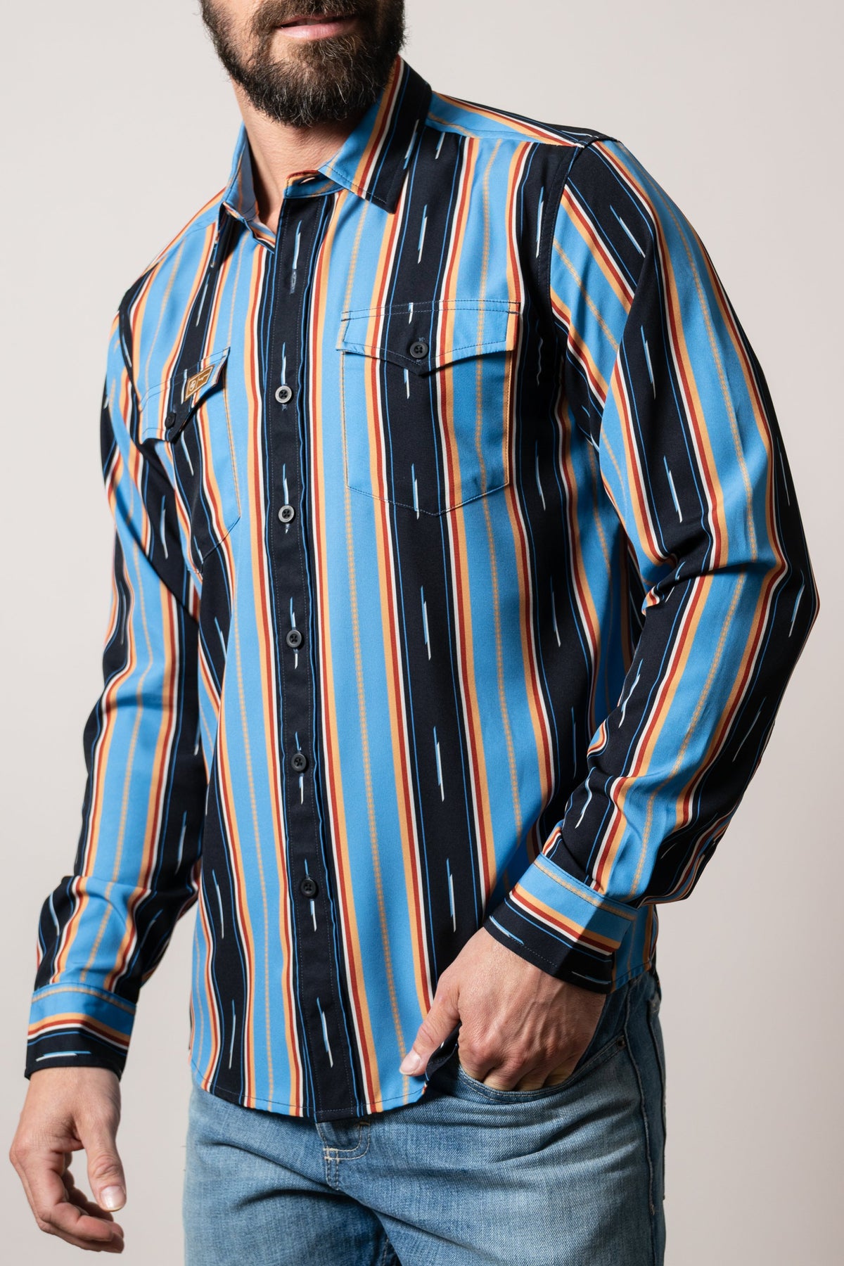 Kimes Ranch ZT Hickory long sleeve dress shirt in Mid Blue with vertical stripes, button pockets and Kimes Ranch logo