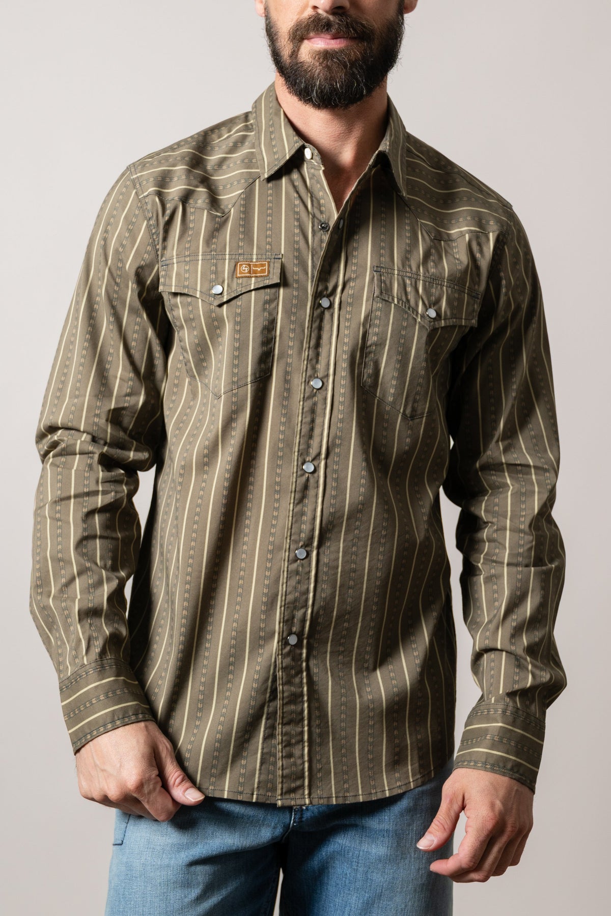 Kimes Ranch ZT Solano Army Green striped long sleeve dress shirt with western yoke, two chest pockets, and logo