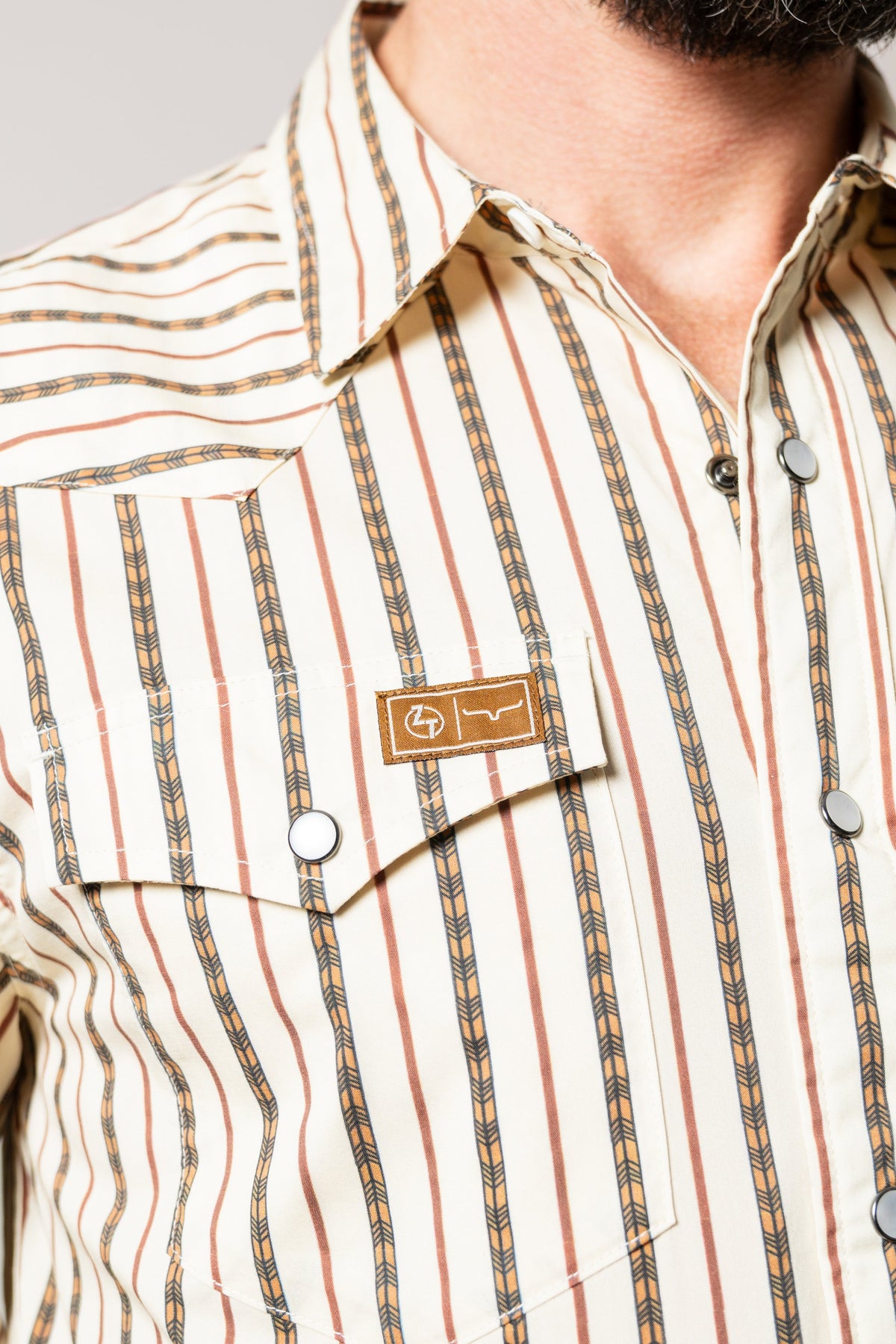 Kimes Ranch ZT Solano natural dress shirt with rust and tan vertical stripes, chest pocket and logo patch