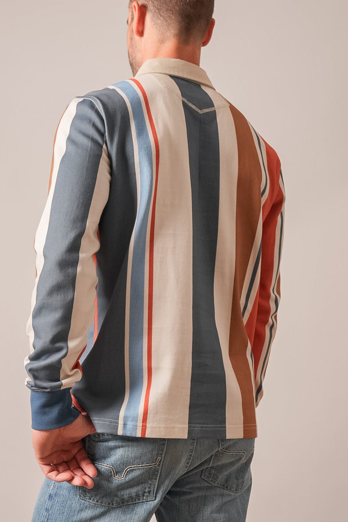 Kimes Ranch ZT Wyatt men's long sleeve polo shirt, back view, dark blue with white, red, and tan vertical stripes