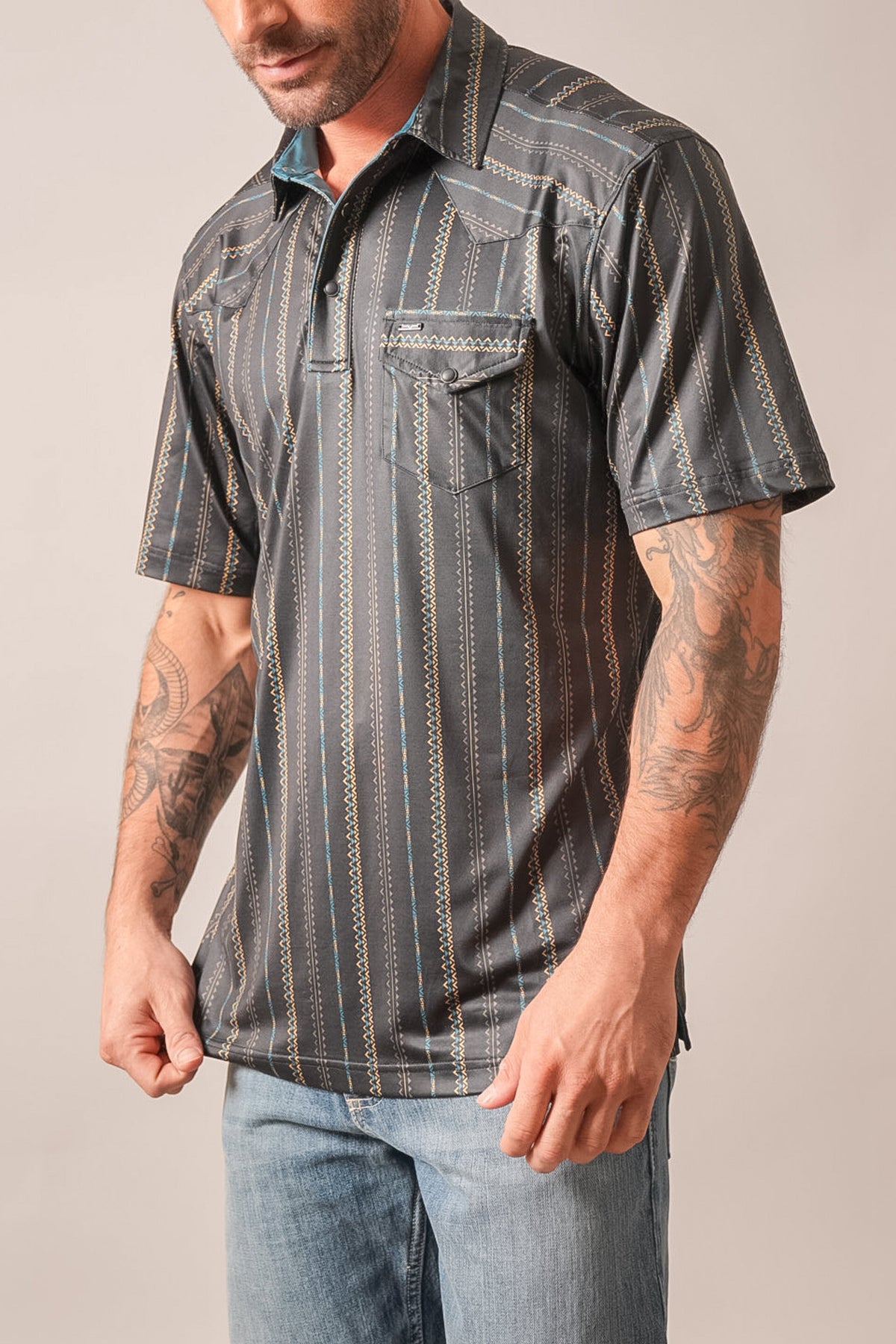 Kimes Ranch ZT Z-Stripe polo in black with short sleeves, chest pockets, and vertical blue and tan stitched patterns